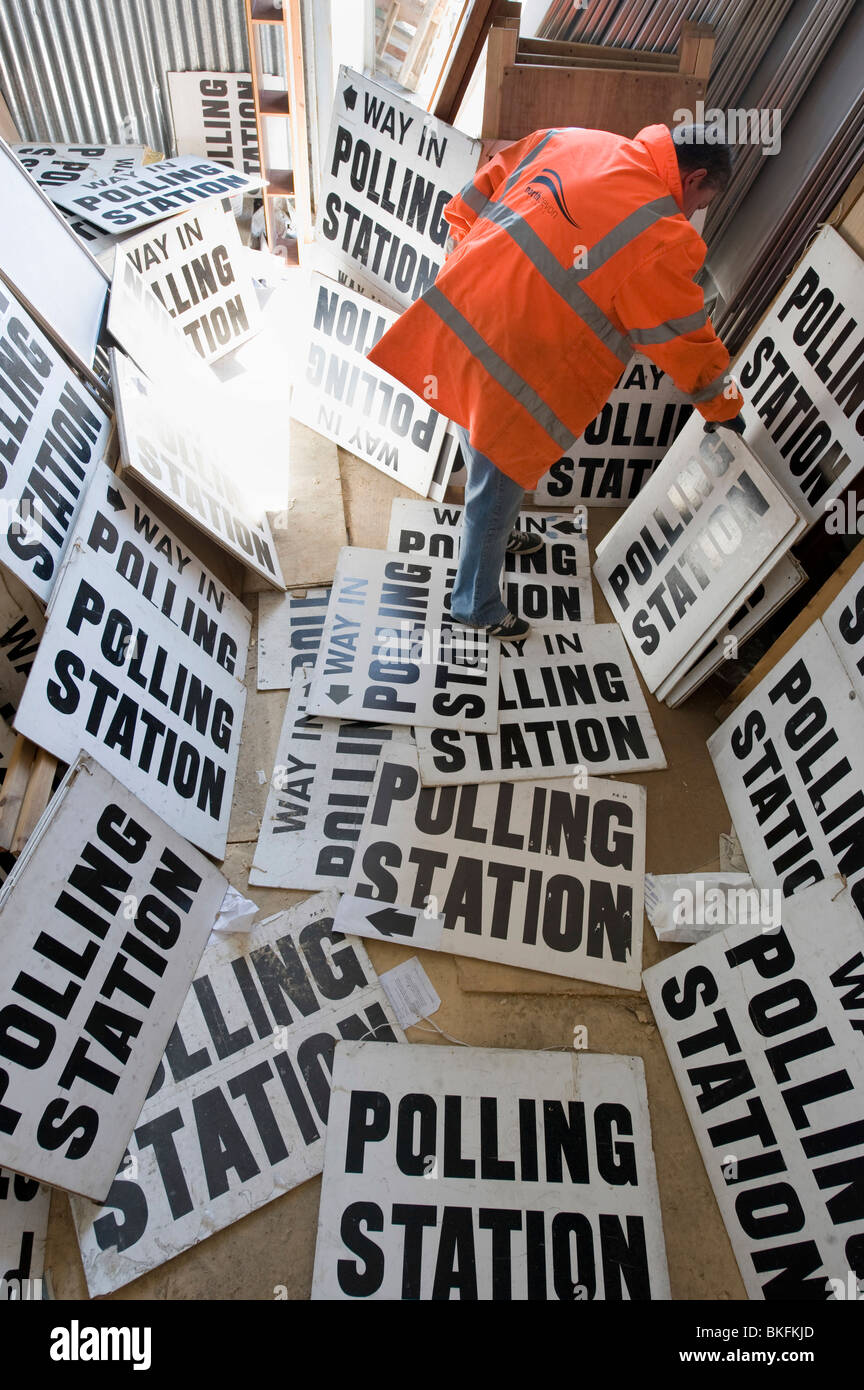 A council official sorts through 100's of polling signs and booths in the run up to a General Election, UK Stock Photo