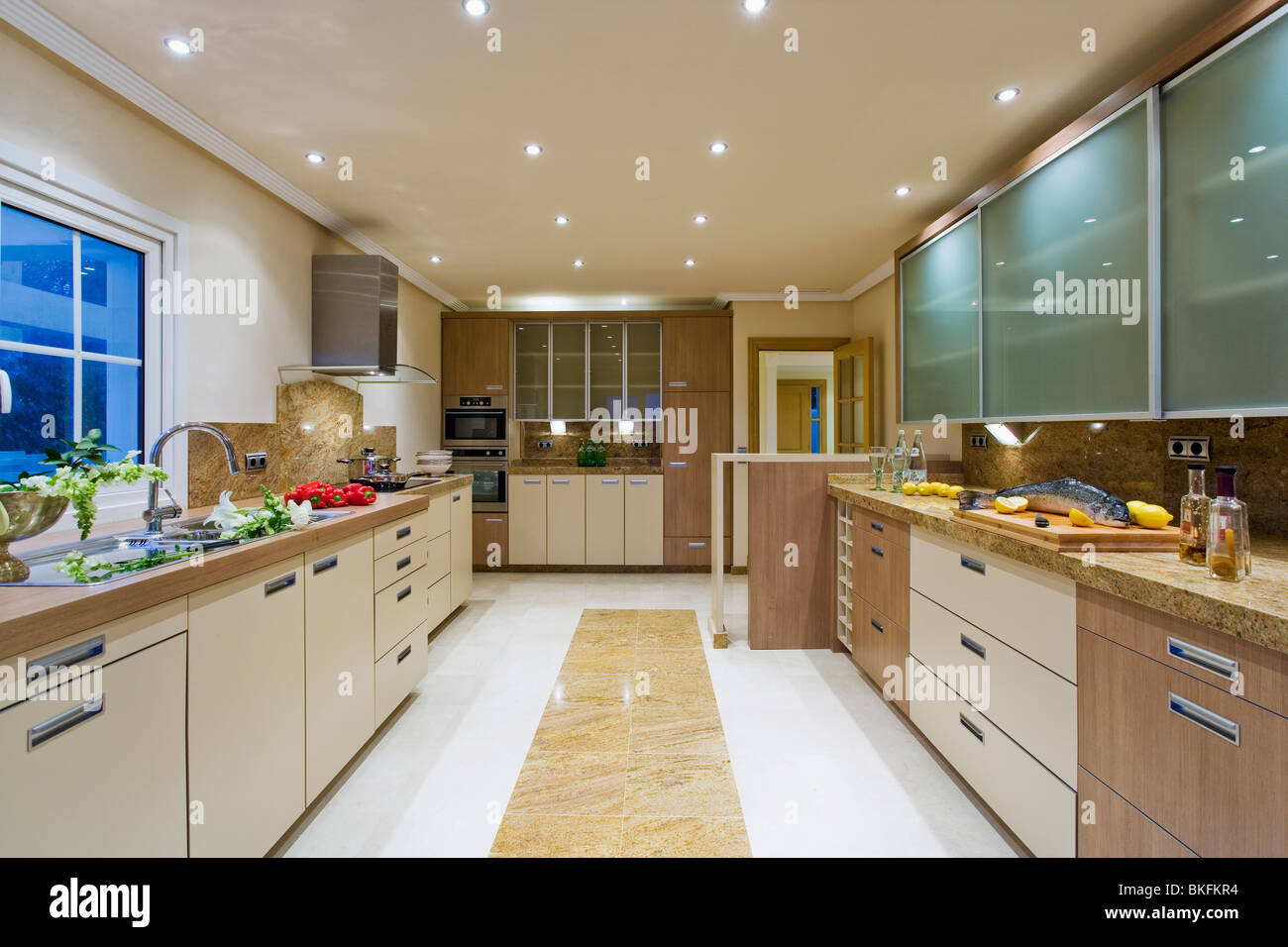 Photo inspiration: Visual Reference: Down Lighting In Large Modern Apartment Kitchen With Opaque Glazed