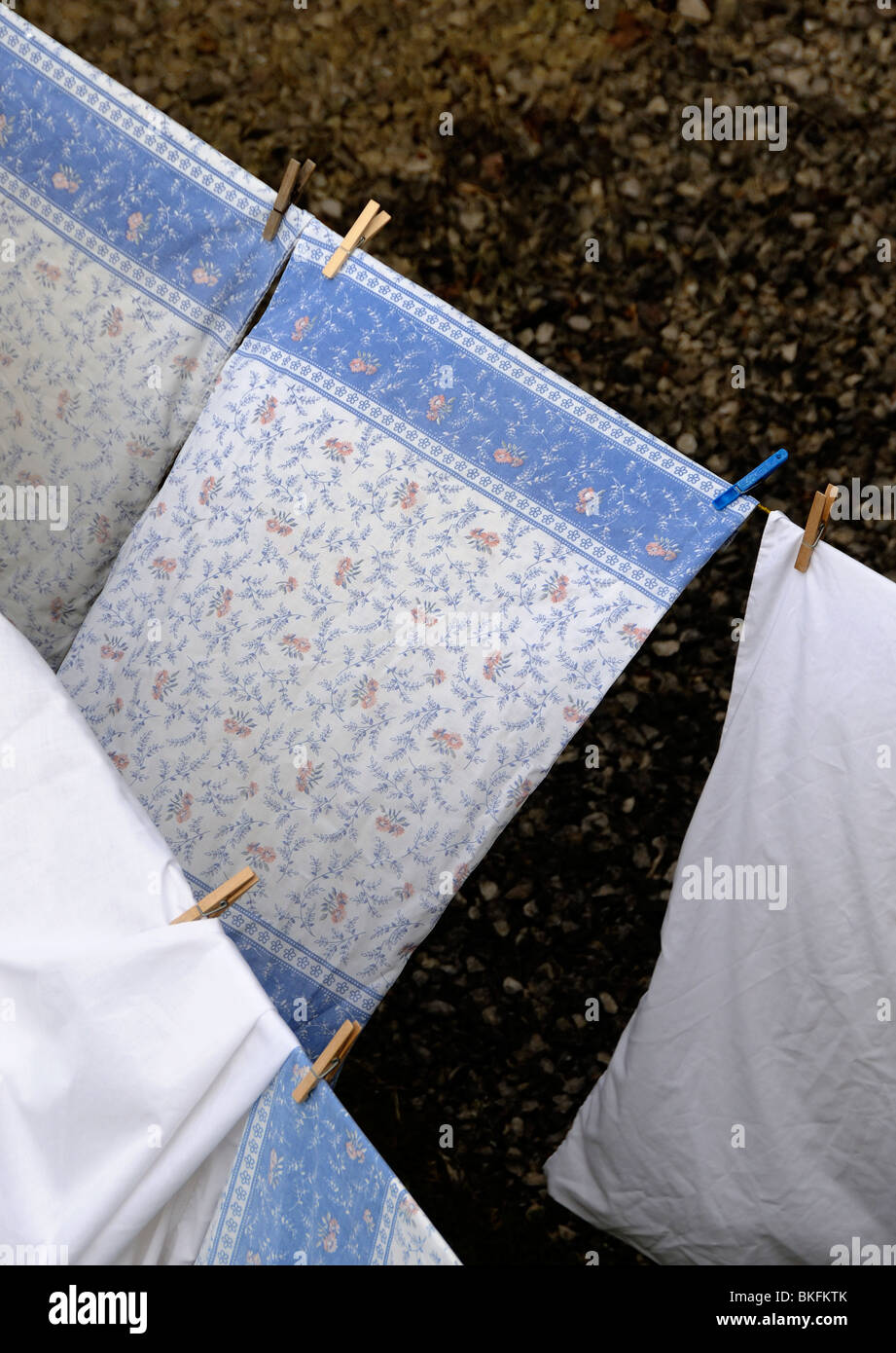 bedding washing sheets hanging out to dry Stock Photo Alamy