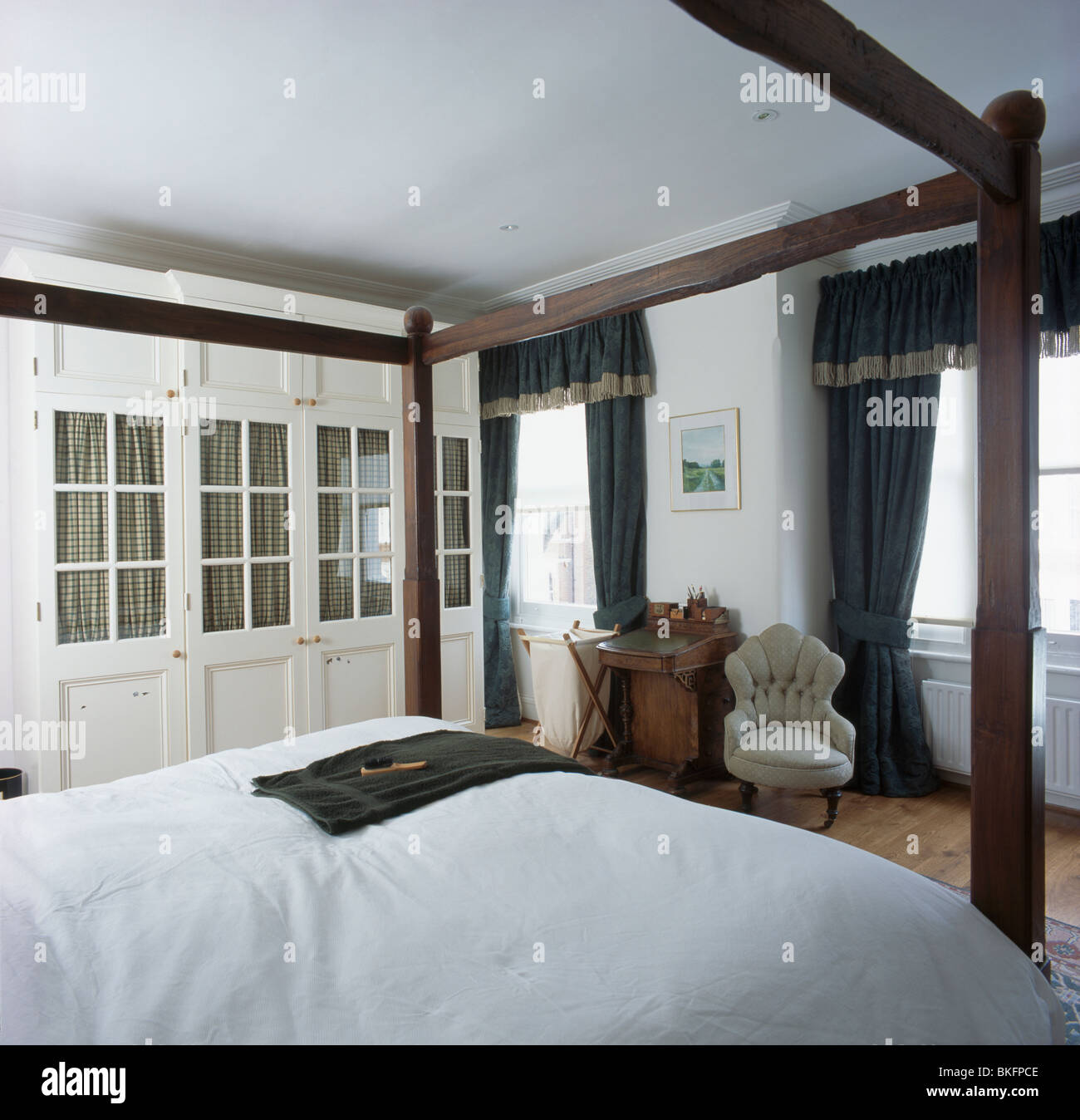 Simple Four Poster Bed In Traditional Bedroom With Fitted