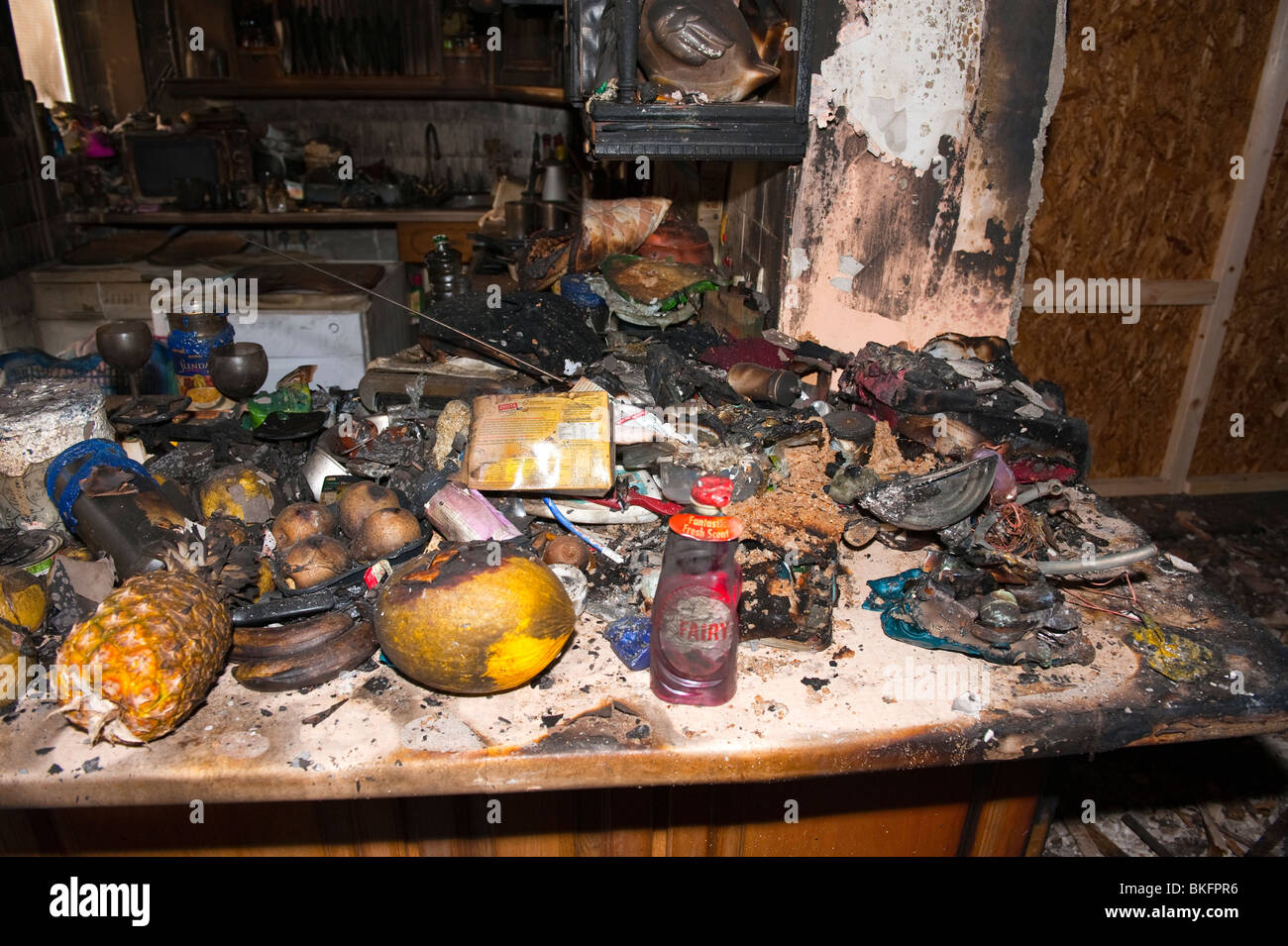 Kitchen food and units severely damaged following domestic house kitchen fire Stock Photo