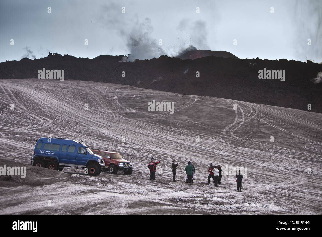 Tourist and Scientist snow  and ash at Fimmvoduhals, volcanic eruption, Iceland Stock Photo