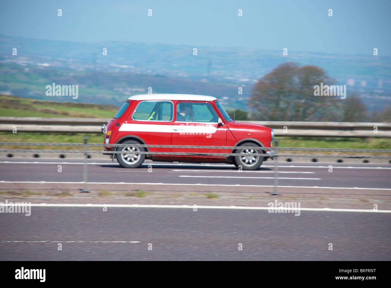Red mini on the M62 Stock Photo