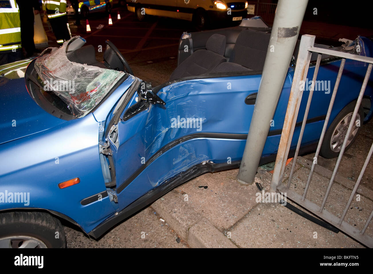 Car crash side impact on lamppost damage Stock Photo