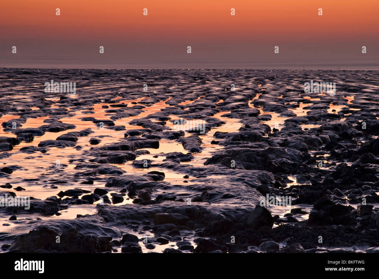 Sunset over the mudflats at Sandpoint, near Weston Super Mare, England Stock Photo