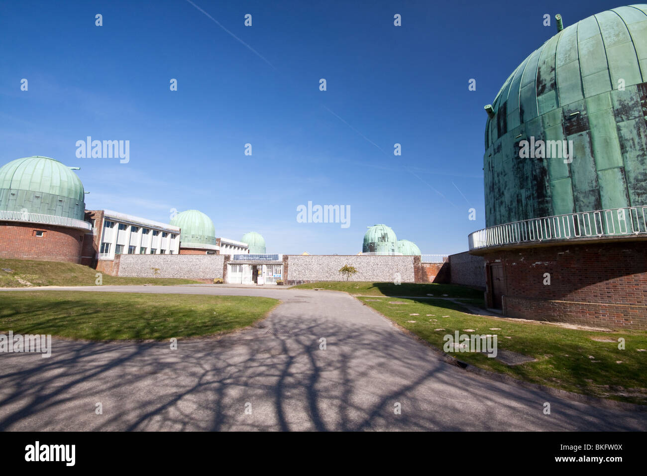 Domes at Herstmonceux Observatory, formerly part of the Royal Greenwich Observatory Stock Photo
