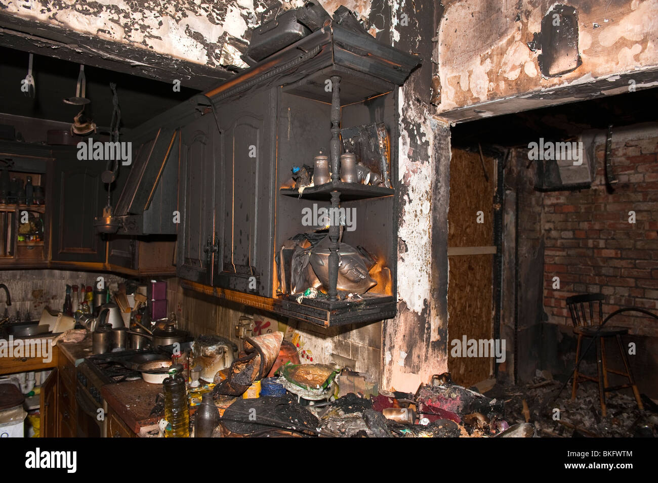 Kitchen food and units severely damaged following domestic house kitchen fire Stock Photo
