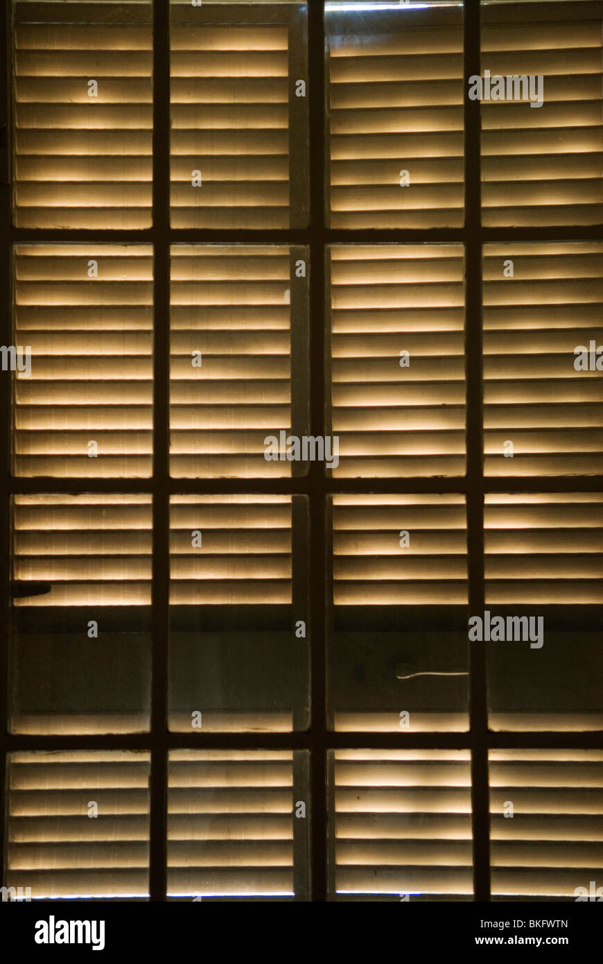 Wooden blind window shutters light pattern. Stock Photo
