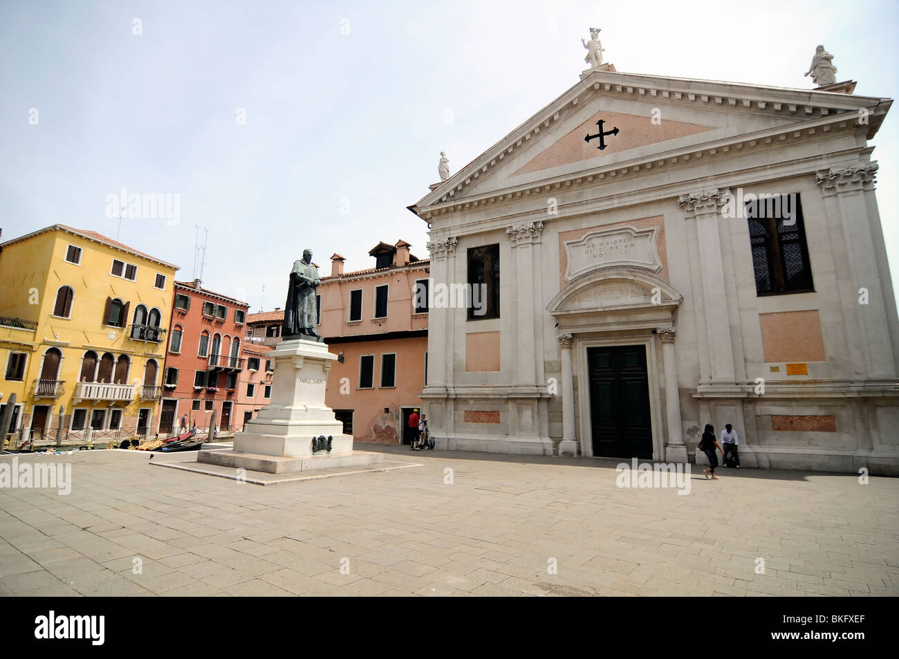 Church, statue and houses around a square, in Venice (Italy) Stock Photo