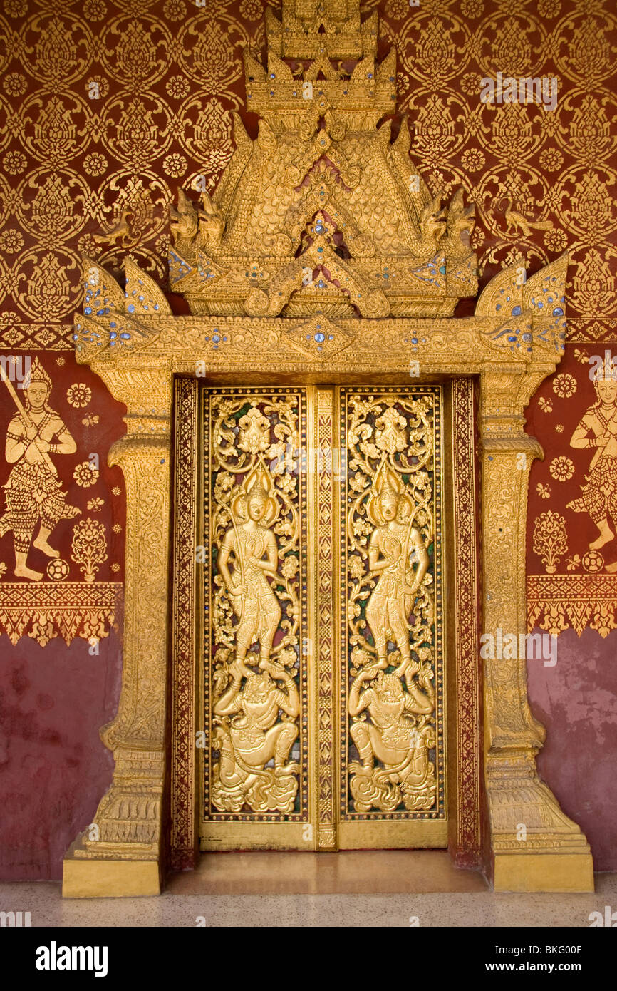 Elaborate wood carvings at Wat Saen's entrance door, Luang Prabang, Laos Stock Photo