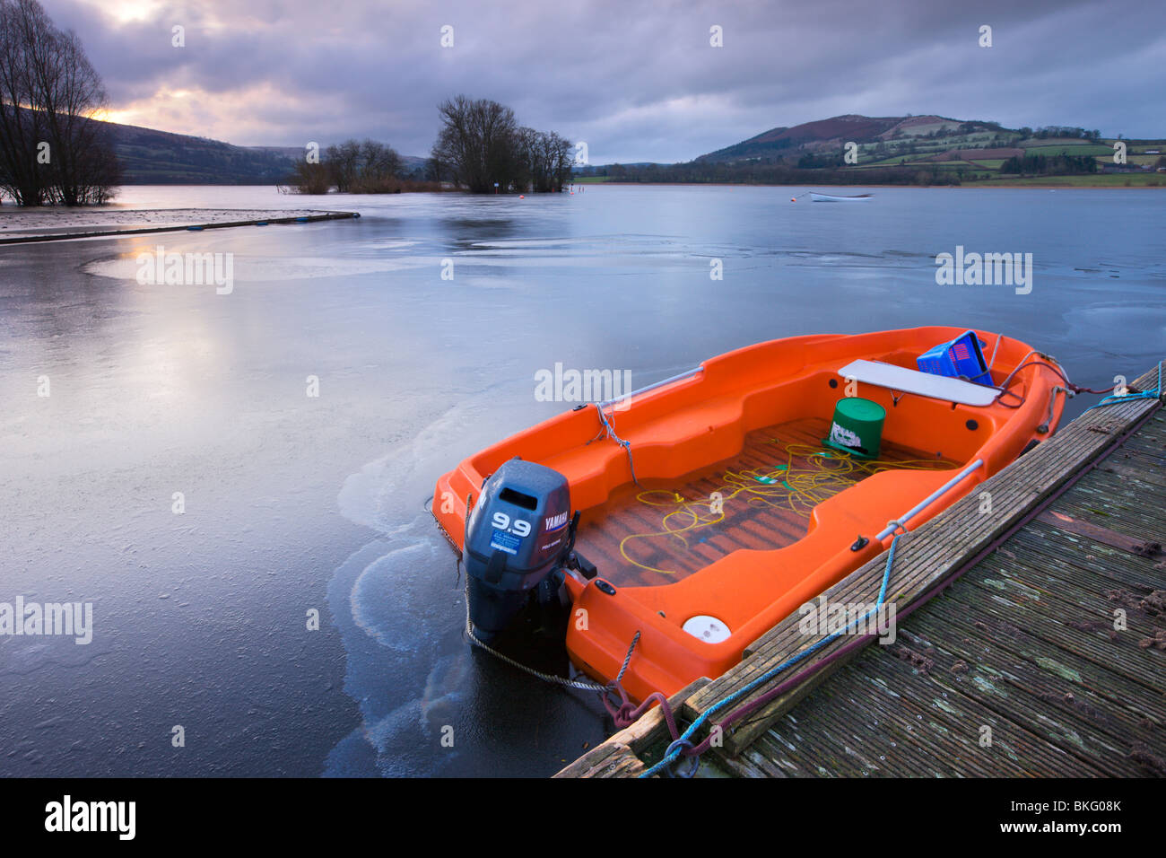 Frozen boat and water at Llangorse Lake in the Brecon Beacons National Park, Powys, Wales, UK. Winter (January) 2010. Stock Photo