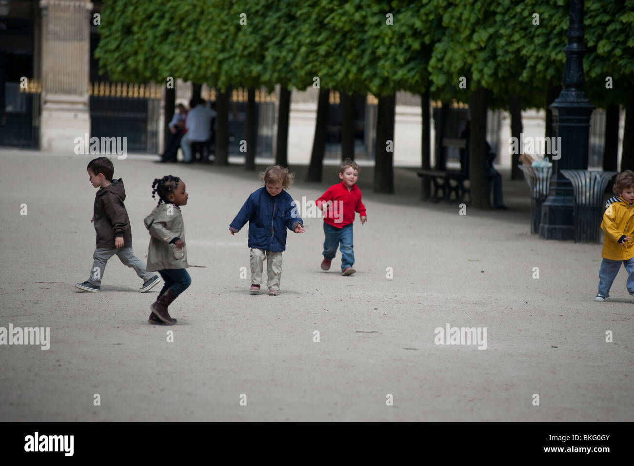 Group of French Children Enjoying, Playing, in Urban Park, 'Jardin du Palais Royale', Gardens, Paris, France, diverse people group Stock Photo