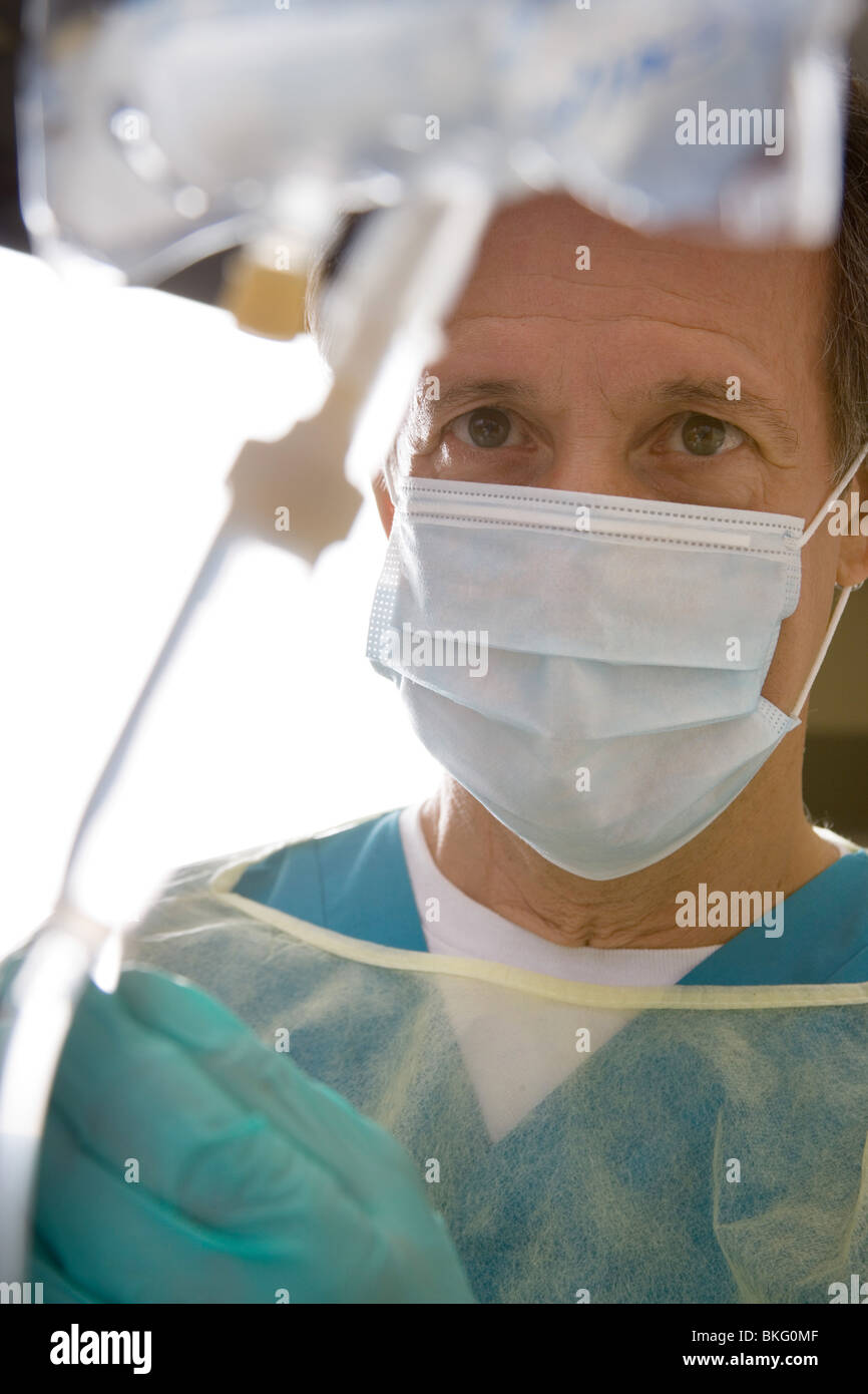 Doctor wearing protective clothing in clinic or hospital. EMS