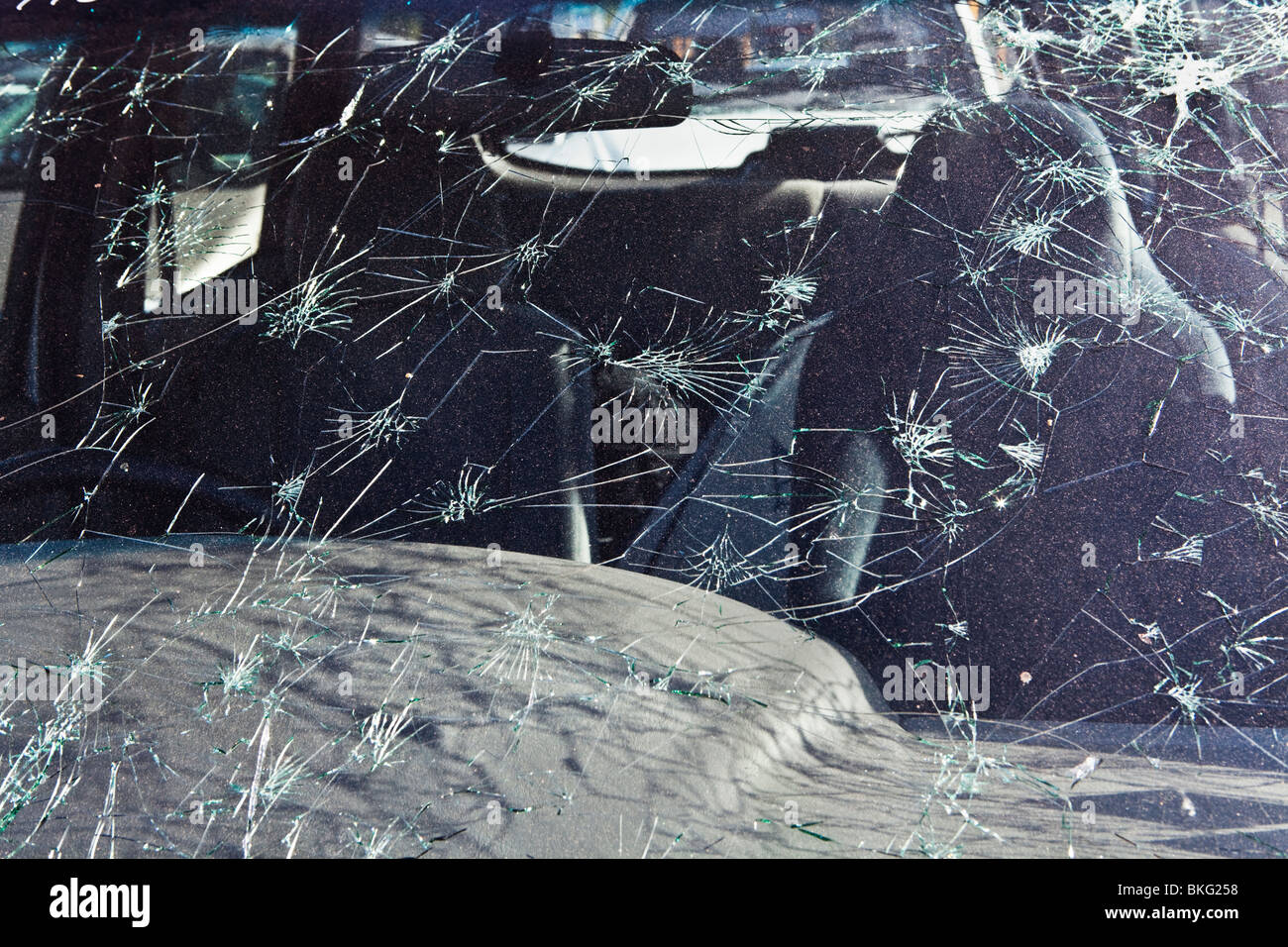 Cracked car windscreen from hail storm damage Stock Photo