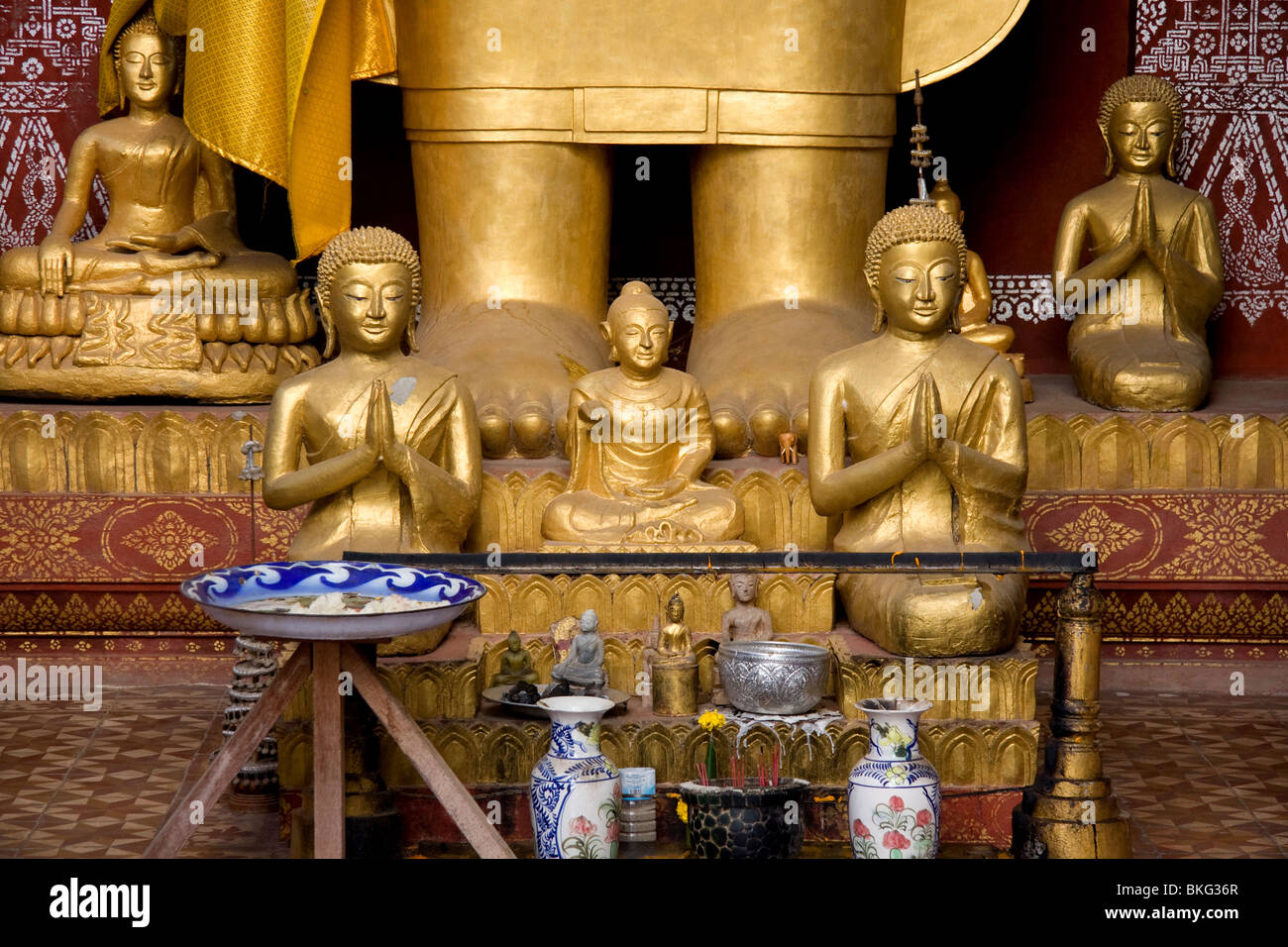 Various Buddha statues inside Luang Prabang's Wat Saen temple Stock Photo