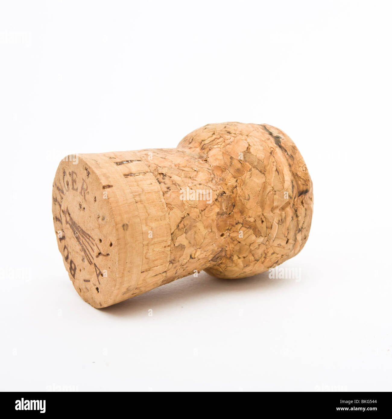 Champagne Cork from expensive bottle of Bollinger vintage French champagne isolated against white background. Stock Photo
