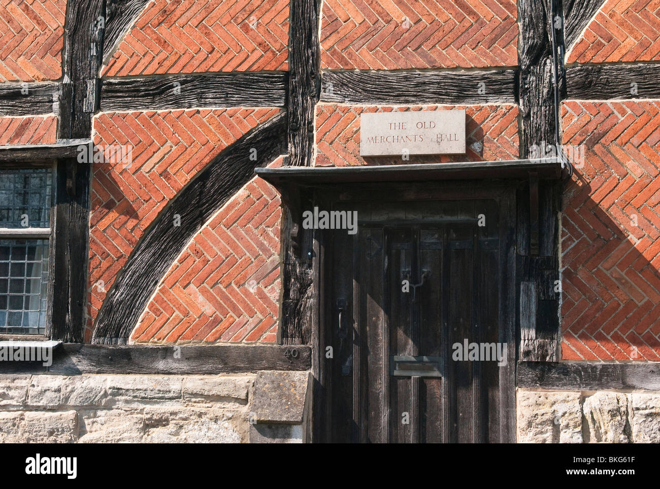 Detail of timber and brickwork on the Old Merchants Hall in Steeple Ashton Stock Photo