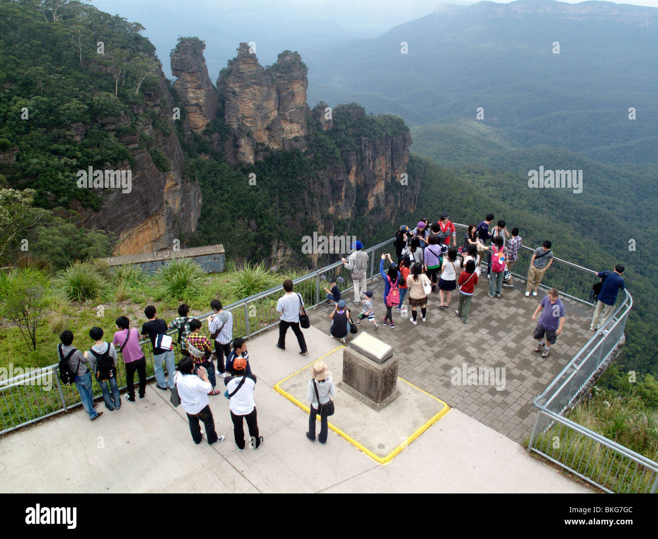 Tourists view the Three Sisters rock formation at Echo Point in Katoomba, New South Wales, Australia Stock Photo