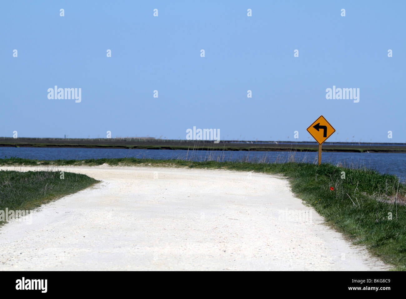 Unpaved road bending left Stock Photo