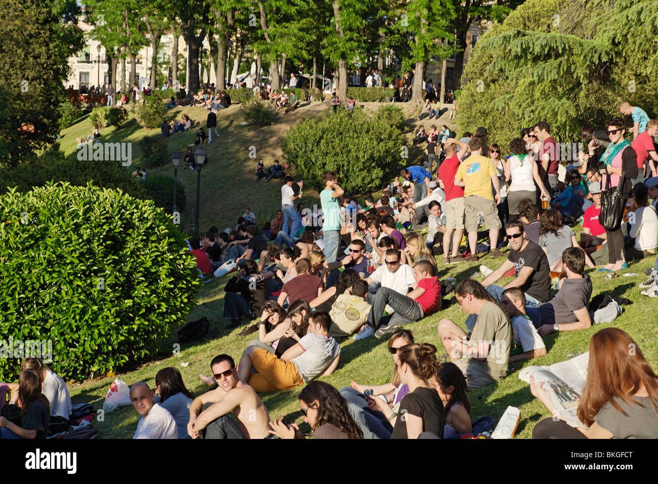 People sitting on grass, Jardines de las Vistillas, Fiestas de San Isidro  Labrador, Madrid, Spain Stock Photo - Alamy