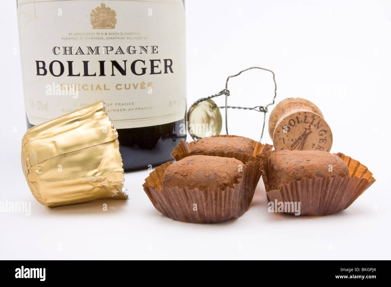 Luxury fair trade Champagne chocolate Truffles, with Bollinger vintage French champagne bottle and cork. Stock Photo