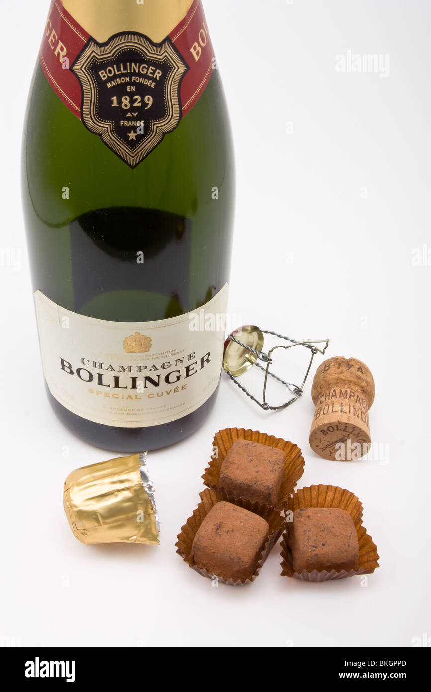 Luxury fair trade Champagne chocolate Truffles, with Bollinger vintage French champagne bottle and cork. Stock Photo