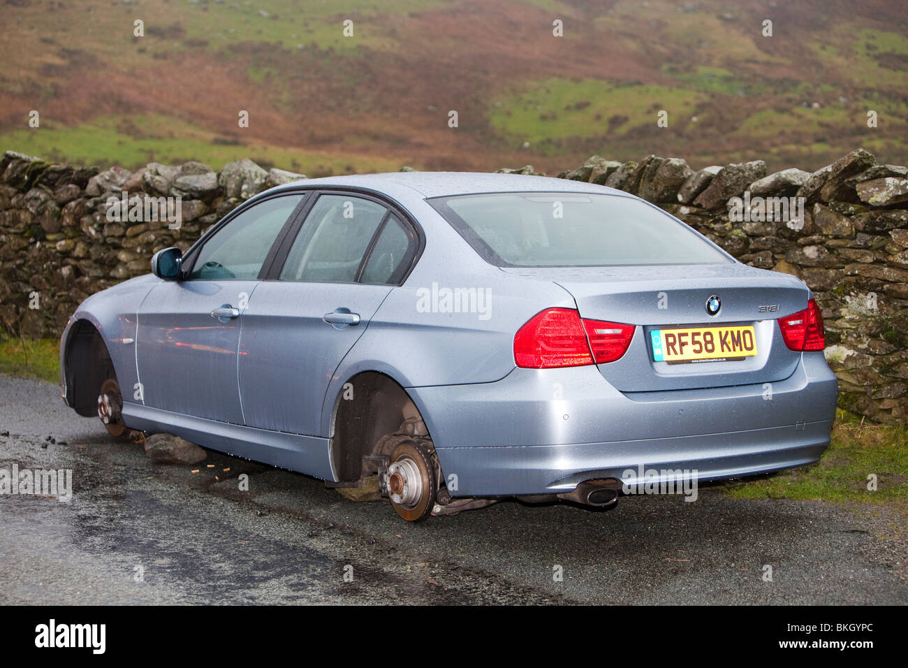Cars abandoned on Kirkstone Pass above Ambleside in the November 2009 floods had their wheels stolen by thieves. Stock Photo