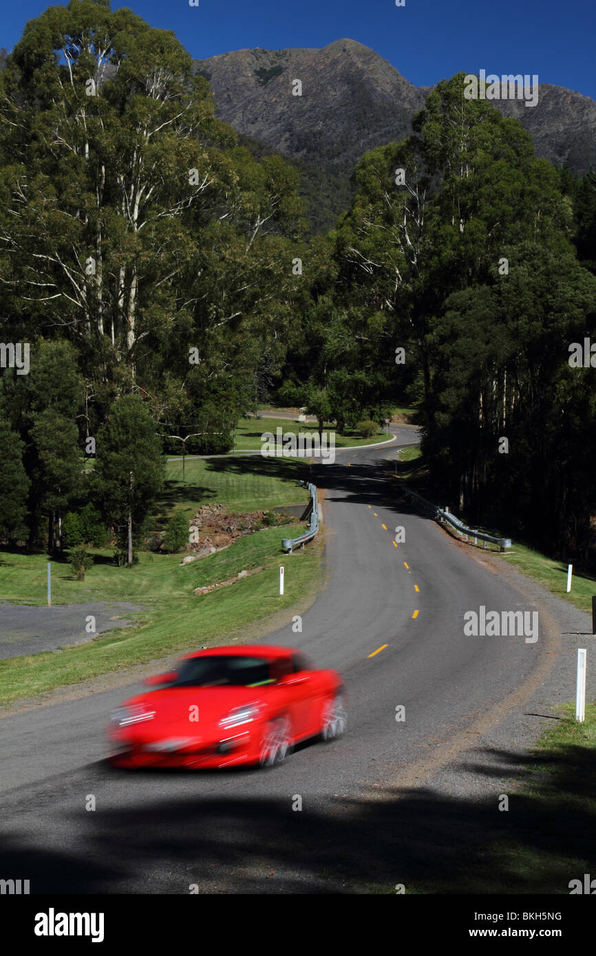 Porsche Cayman S sports car driving on a mountain road in Australia Stock Photo