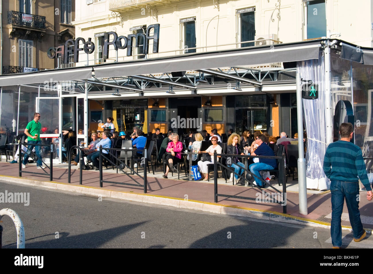 Cannes , La Croisette , Caffe Roma , taking afternoon tea & coffee in the spring sun Stock Photo