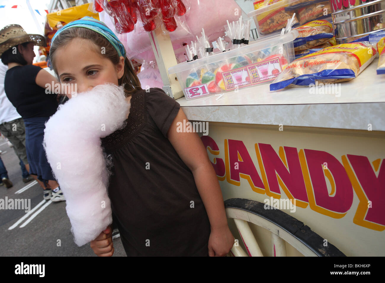 Girl eating candy floss at Primrose Hill Festival, London Stock Photo Alamy
