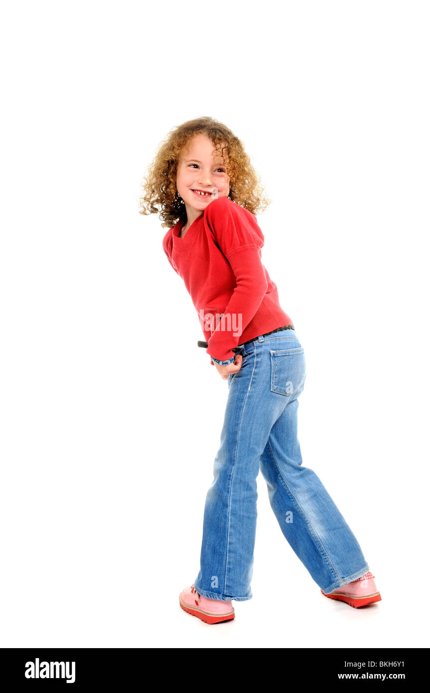 Six year old girl wearing blue jeans a red shirt with 