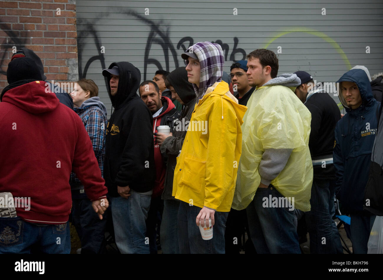 Job seekers wait on line for applications for the apprenticeship