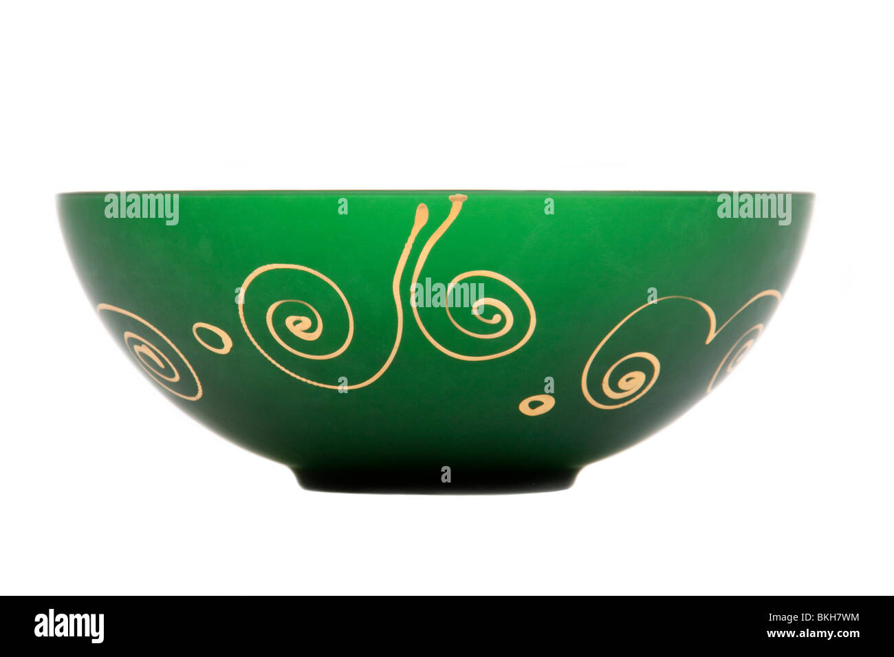 Vintage green Italian glass art bowl hand painted with 22ct Gold patterns, isolated against white background Stock Photo
