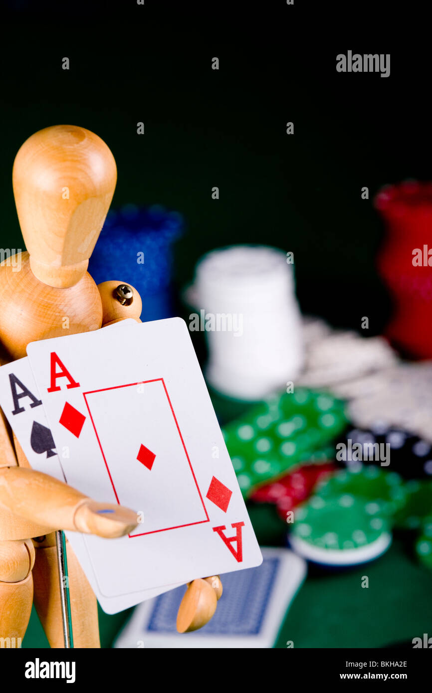 Manikin plays poker Stock Photo