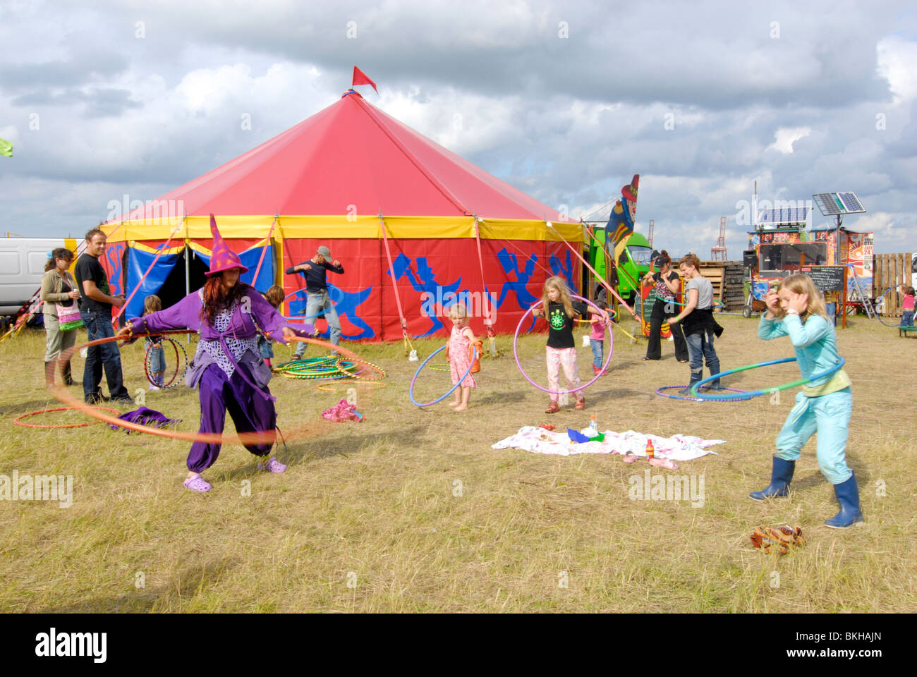 netherlands tent man girls woman hippie festival landjuweel amsterdam circus ruigoord hippy hula hoop lesson Stock Photo