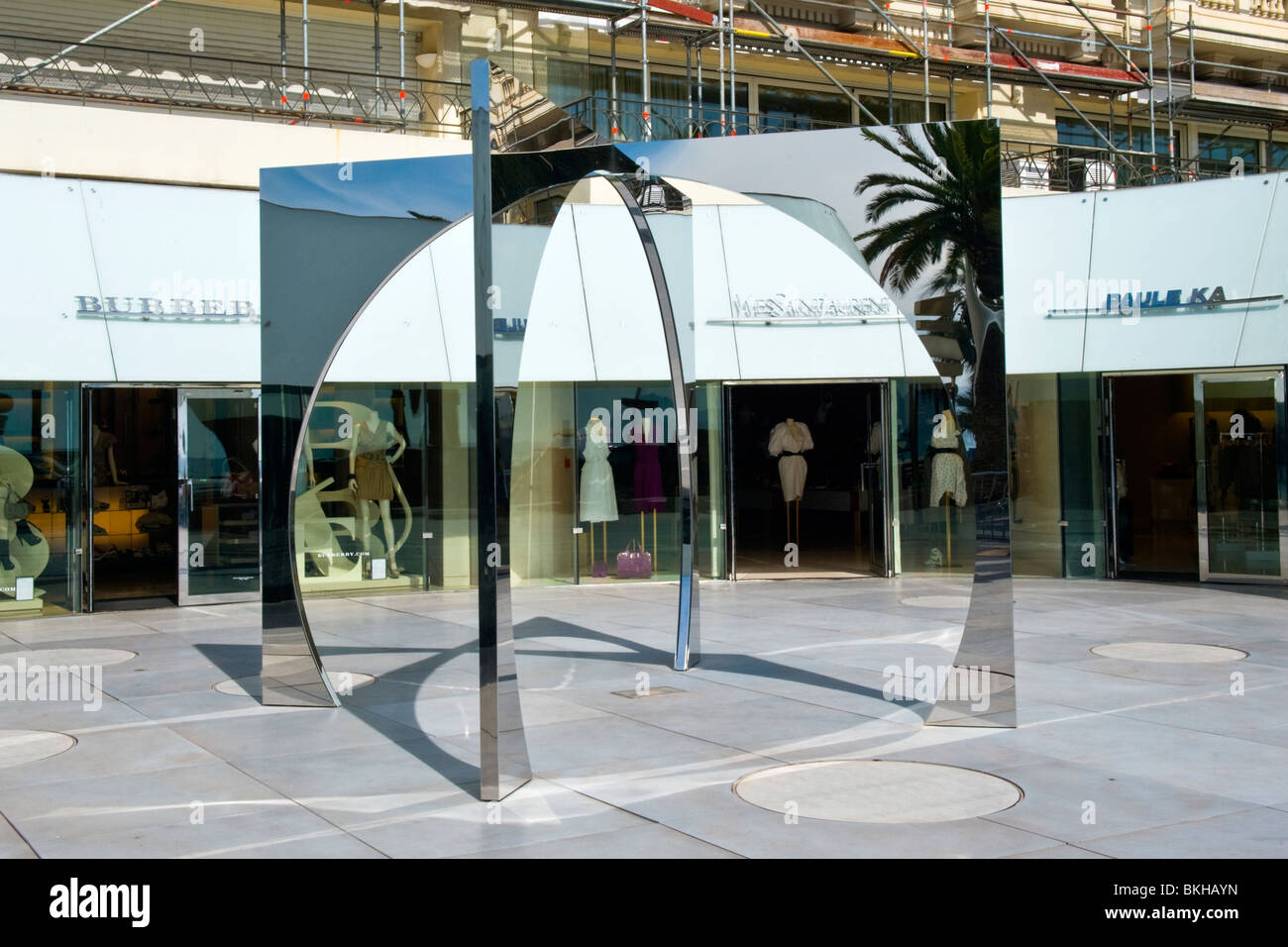 Cannes , La Croisette , luxury shops arcade , Burberry , Yves Saint Laurent  & Paule Ka & modern contemporary chrome sculpture Stock Photo - Alamy