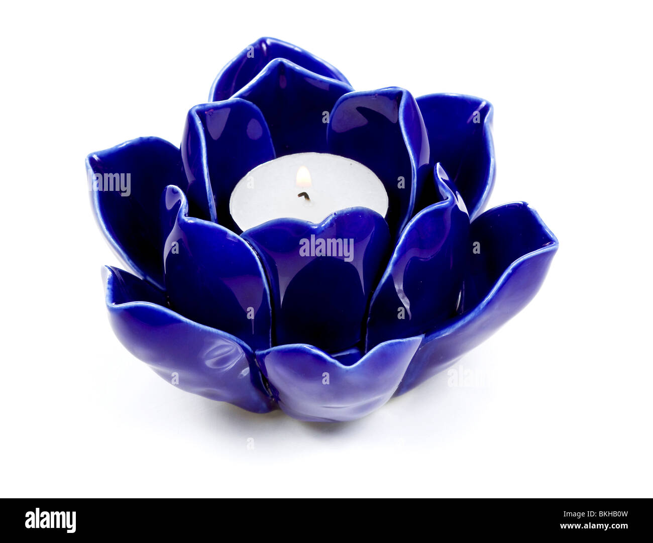 Blue ceramic candle holder with flame Stock Photo Alamy