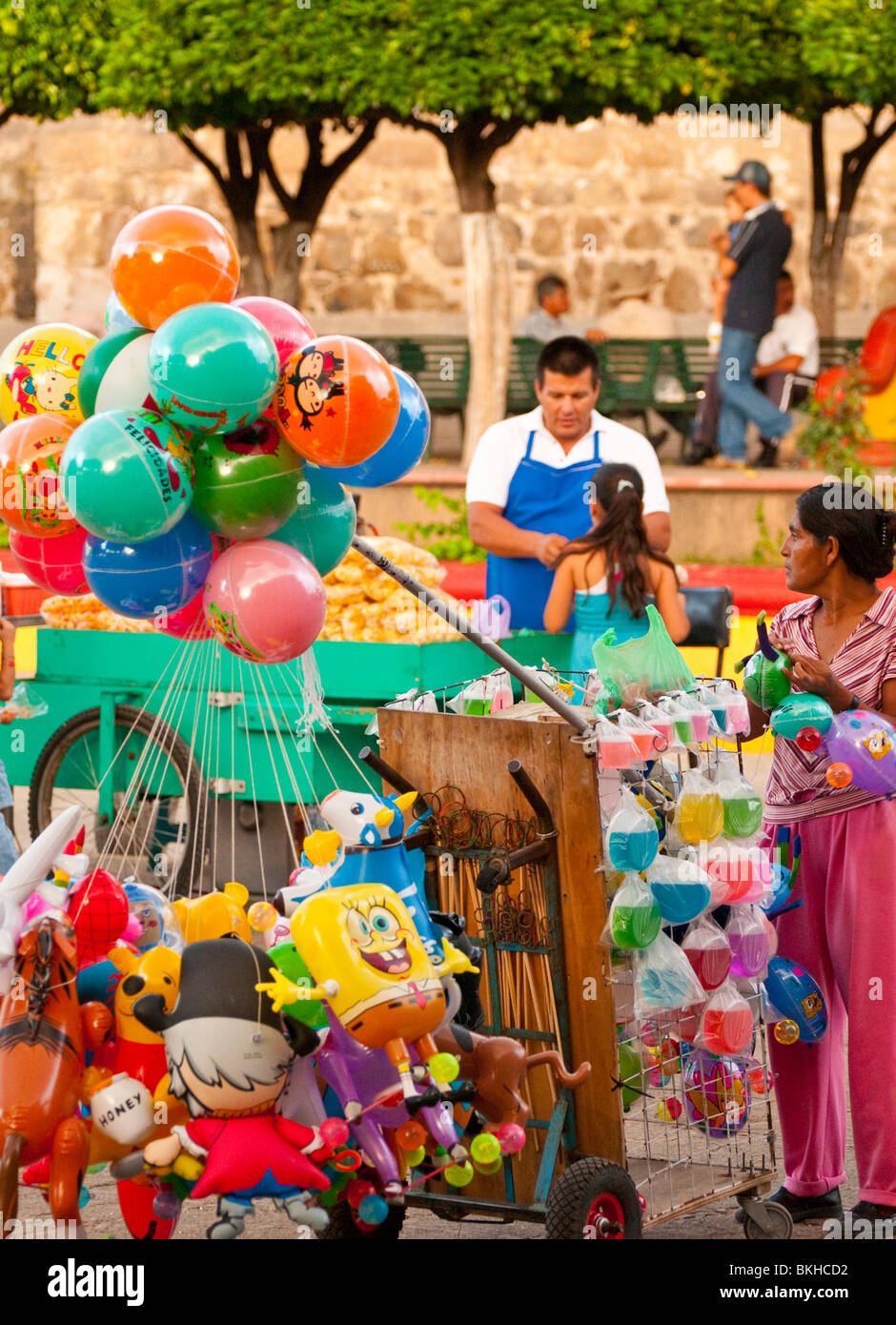 Street vendors selling merchandise and food next to Our Lady of Purisma