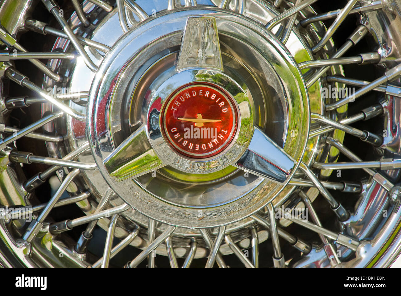 Close-up of the front passenger hubcap/wheel of a classic 1956 Ford Thunderbird automobile. Stock Photo