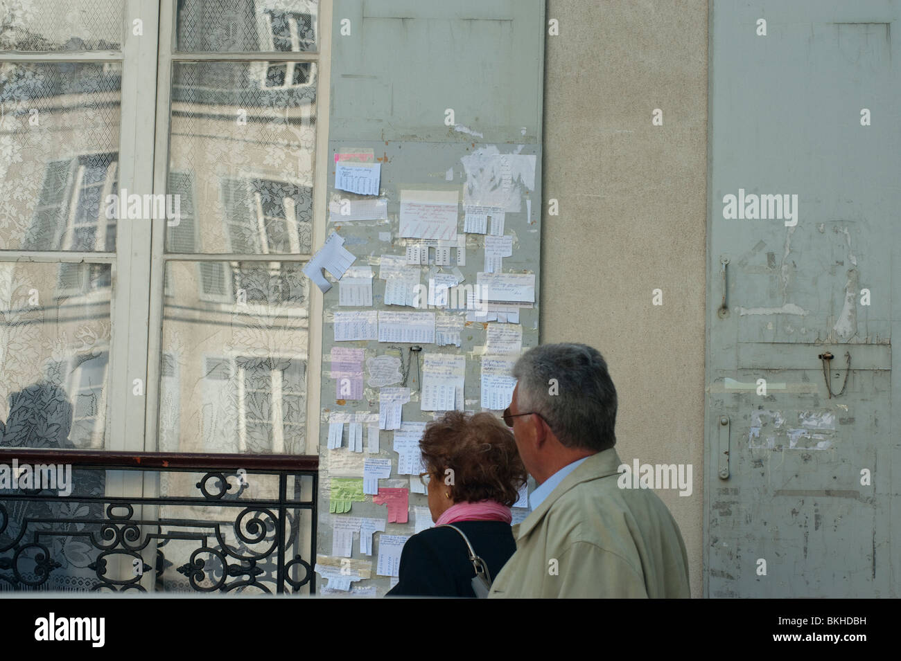 Paris, France, Couple Outside Coptic Russian Church Bulletin Board, Wall Ads Stock Photo