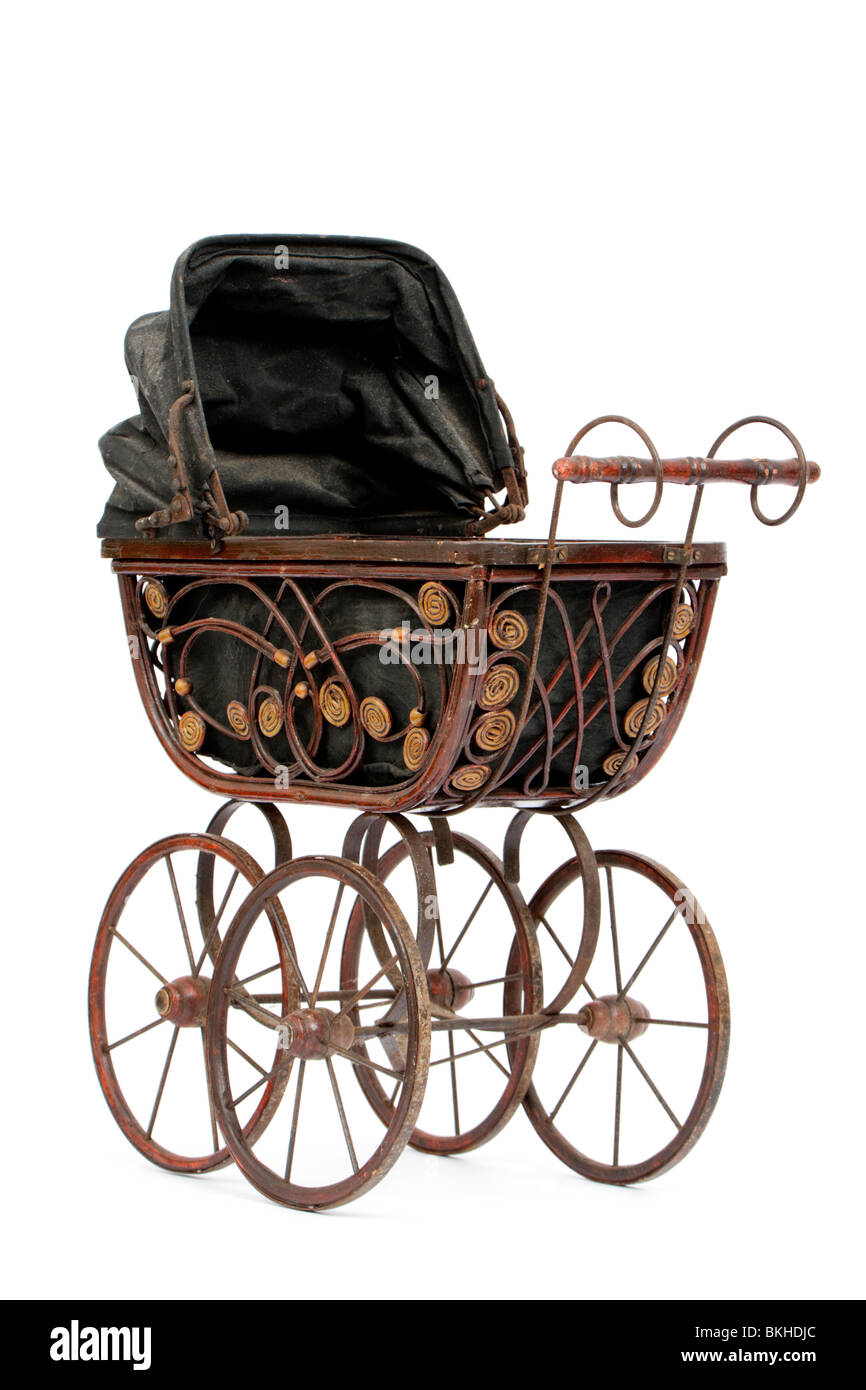 Rare antique Victorian wooden dolls pram with reversible hood, isolated on white background Stock Photo