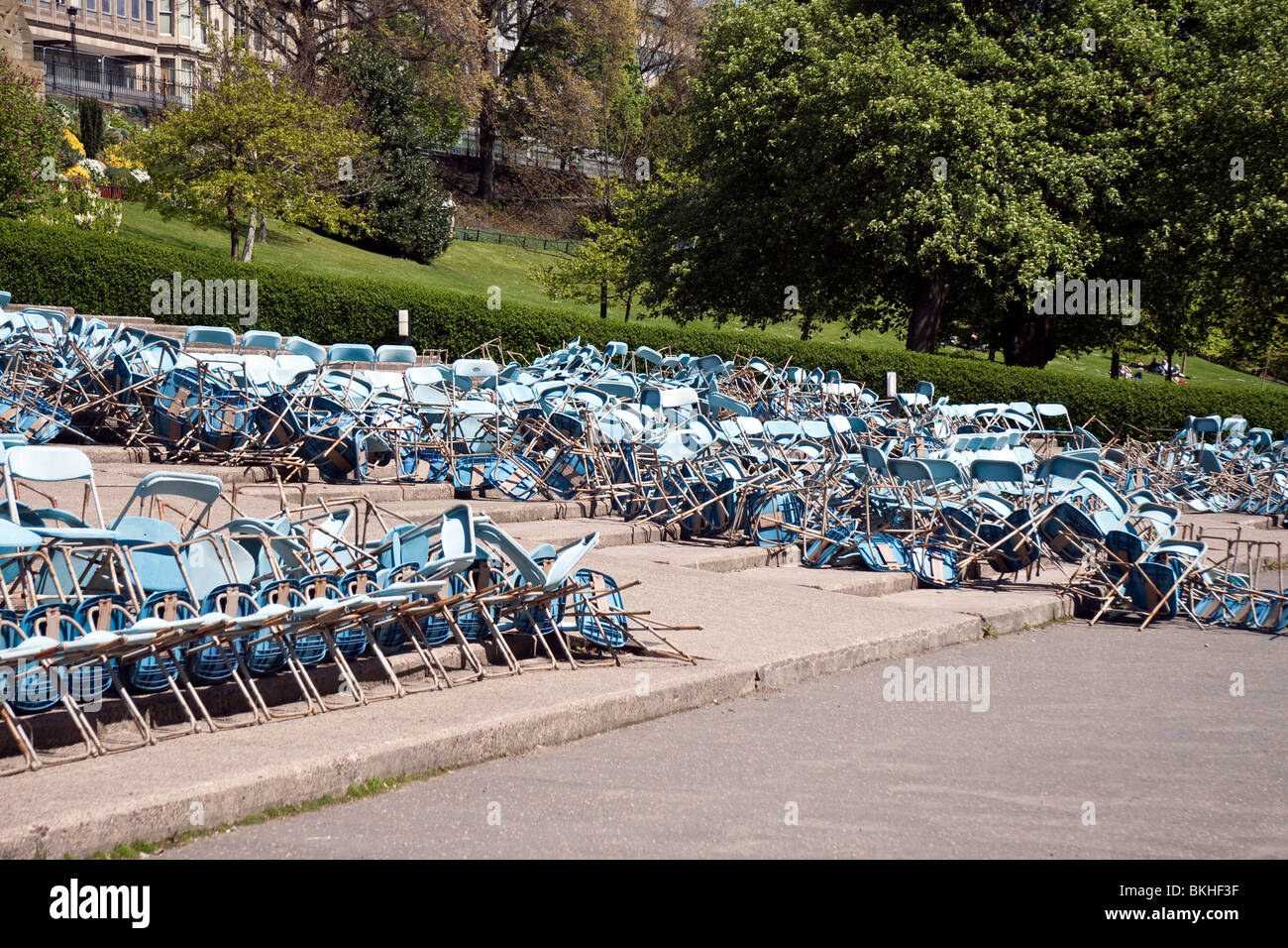 Toppled chairs in the open-air Ross Bandstand in Edinburgh's Princes Street Gardens Stock Photo