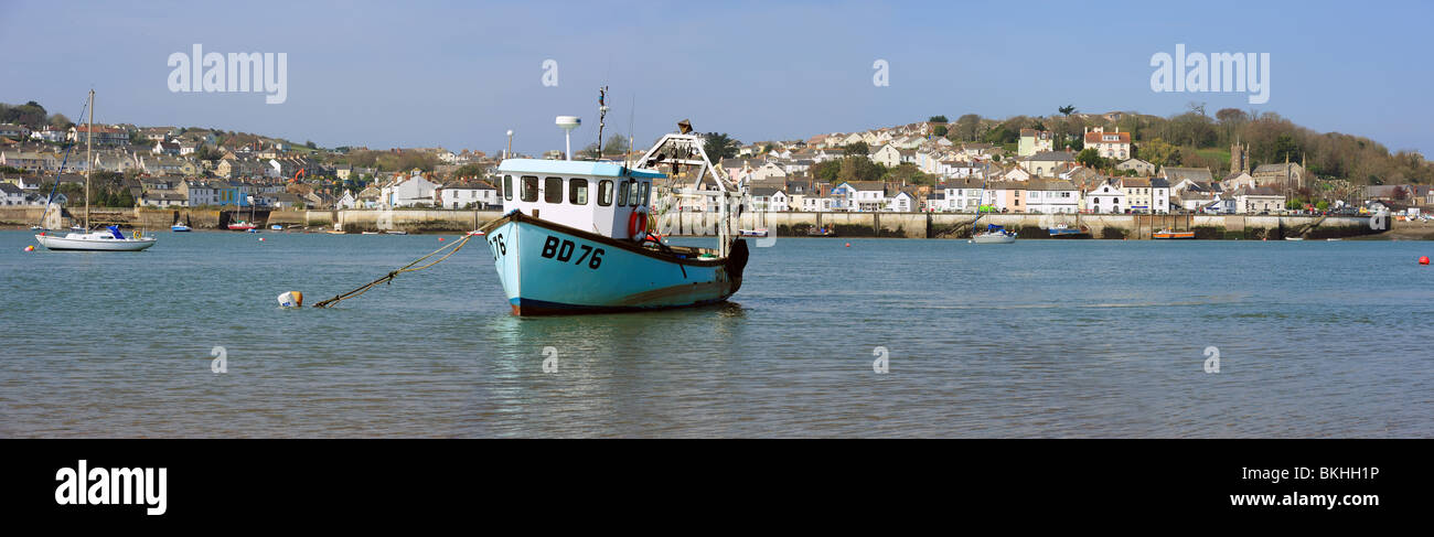 Fishing boat at anchor in front of the North Devon village of Appledore Stock Photo