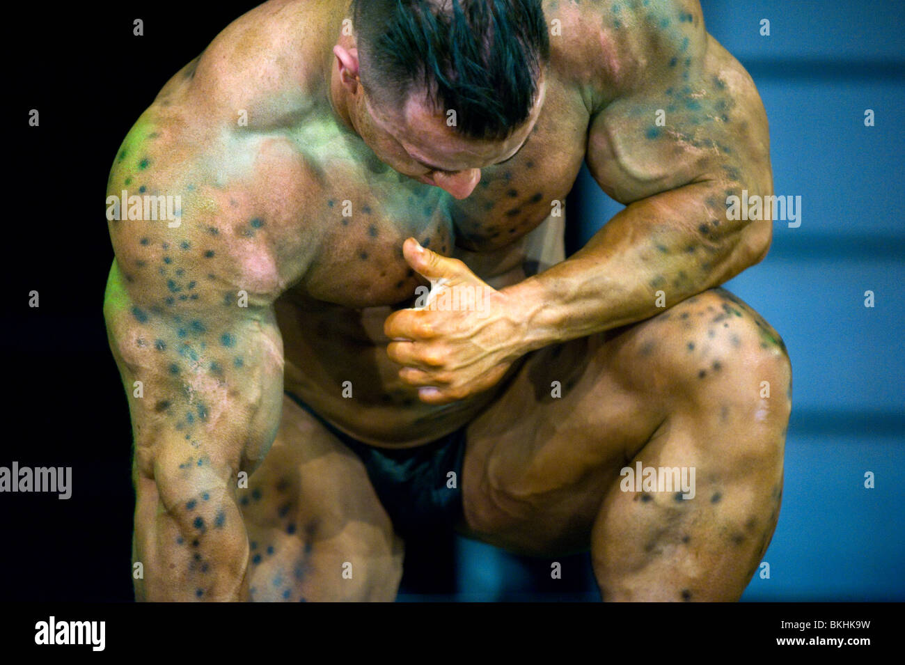 detail of a male bodybuilder with bodypainting during the fitness fair FIBO Power in Essen, Germany. Stock Photo