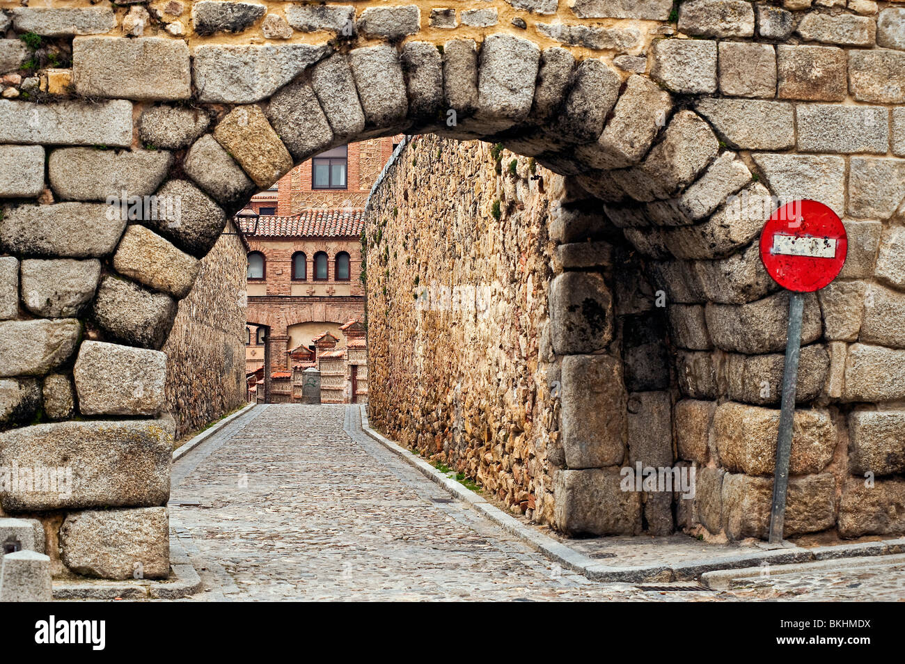 Stone arch and cobble stone street , Segovia, Spain Stock Photo