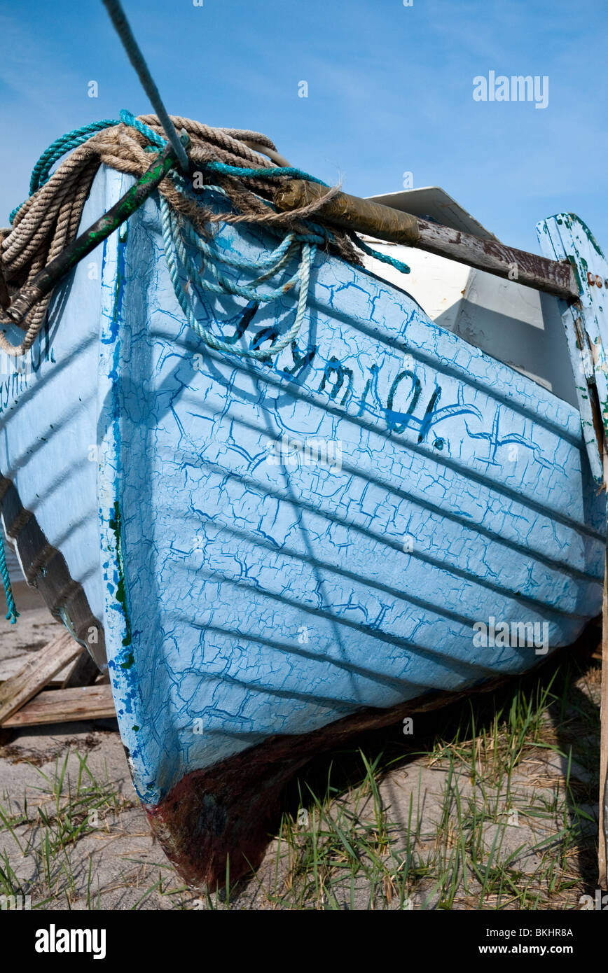 Old disused fishing boat on shore. Denmark, Europe Stock Photo