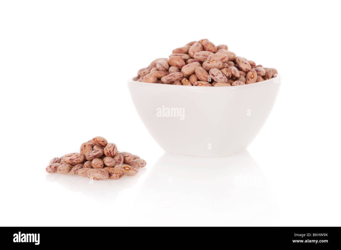 Pinto beans in a bowl isolated on a white background Stock Photo