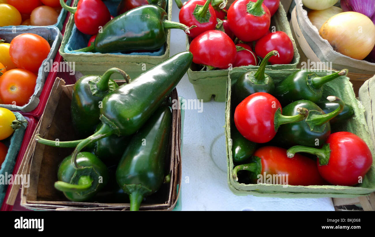 Freshly picked organic peppers on display at farmers market Stock Photo ...