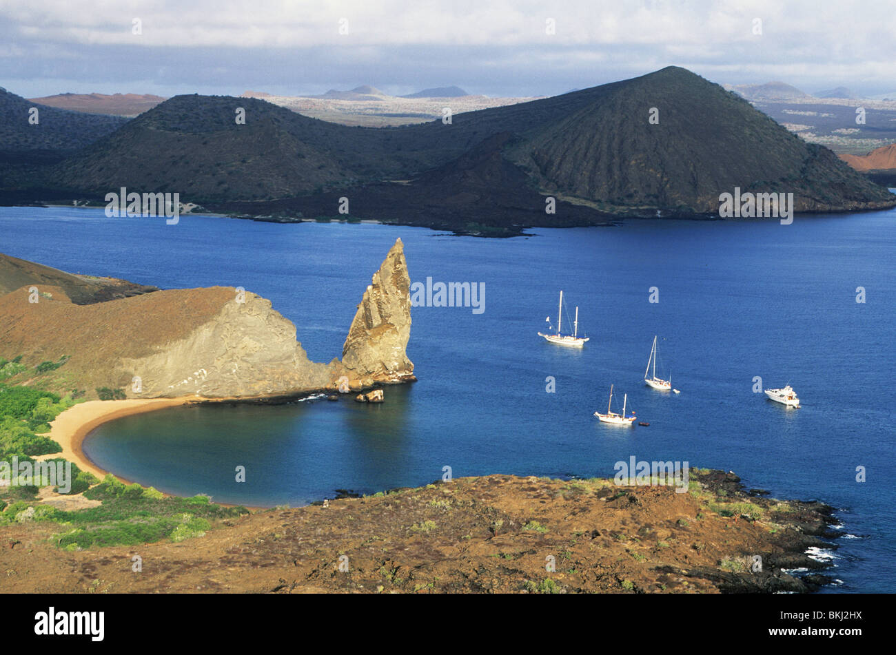 Ecuador, Galapagos Islands, Pinnacle Rock view with boats, Bartolome Island. Stock Photo