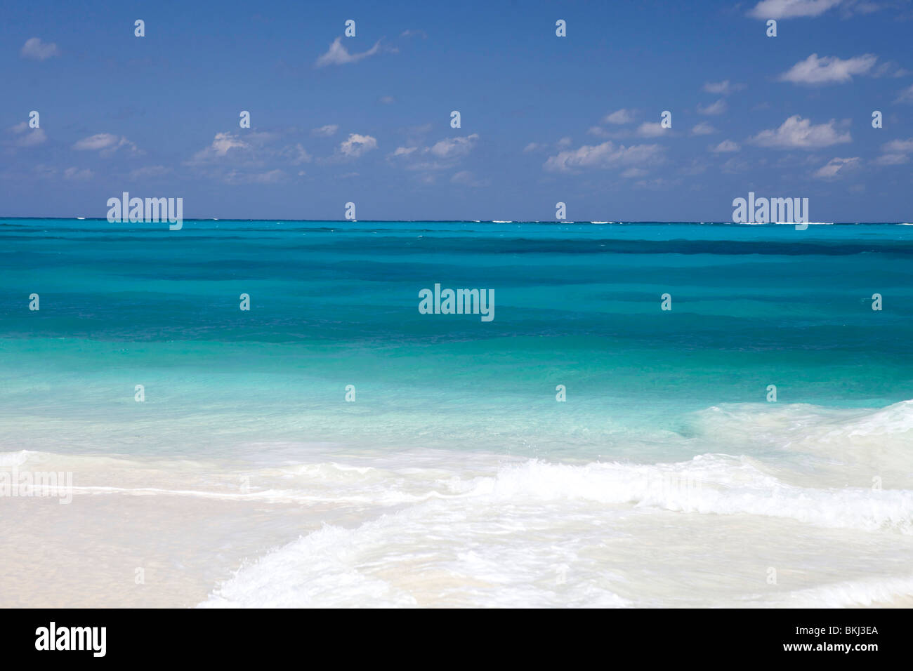 Pristine white sand beach on Man O War Cay and crystal blue water of the Atlantic Ocean. Stock Photo